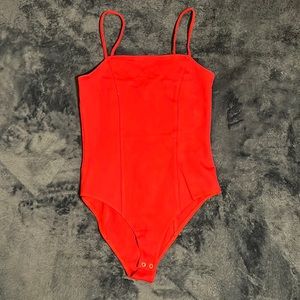 Red bodysuit.
